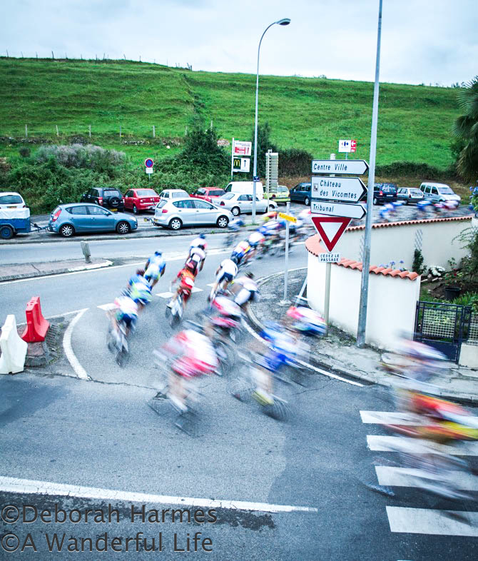 Cyclists-670 Cyclists on a night-time road race in St. Girons in the Midi-Pyrenees in France