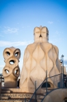 Some of the odd shaped chimney vents atop Antoni Gaudi\'s Casa Mila - La Pedrera